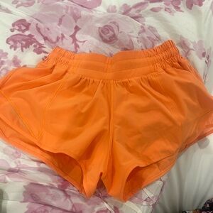 Highlighter orange Lululemon shorts